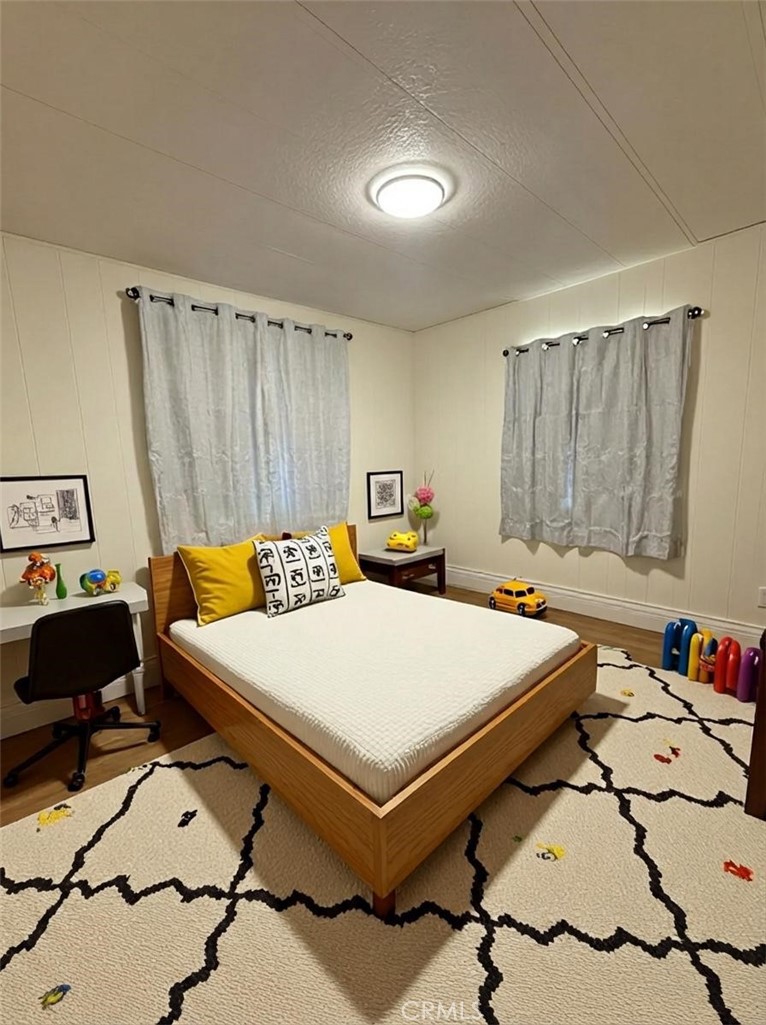 32883 Newberry Road Newberry Springs, CA 92365 - Photo 5 of 14 a bedroom with a bed and a table in it