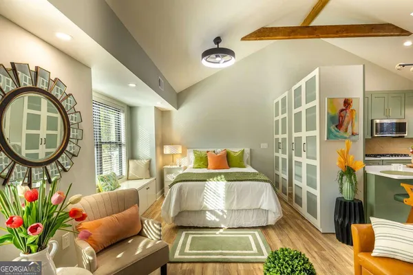 a living room with a couch and a table with wooden floor