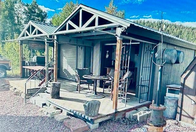 44 Clubcar Road Fairplay, CO 80440 - Photo 4 of 13 a front view of a house with outdoor seating