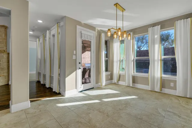 a view of a room with windows and entryway