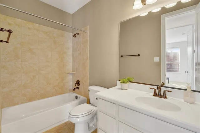 a view of livingroom with furniture and chandelier fan