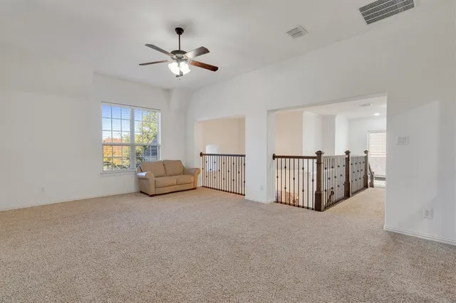a view of a livingroom with a ceiling fan furniture and ceiling fan