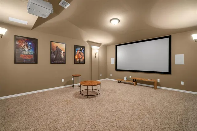 a bedroom with a bed and a large mirror