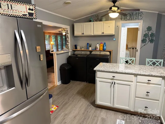 a kitchen with a sink stainless steel appliances and cabinets