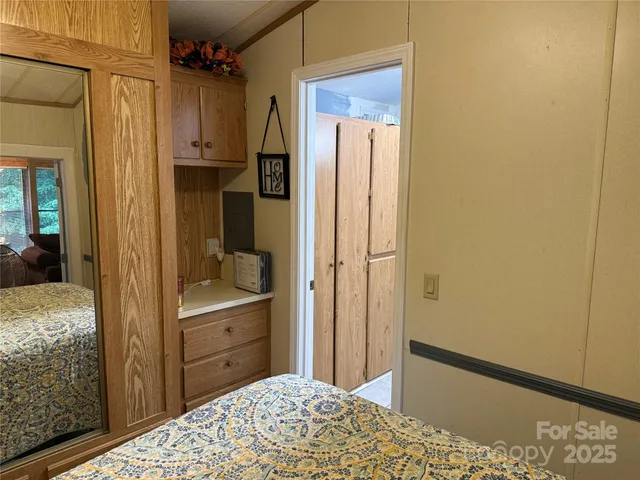 a bedroom with a bed and a dresser