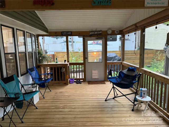 a view of a chairs and table on the deck
