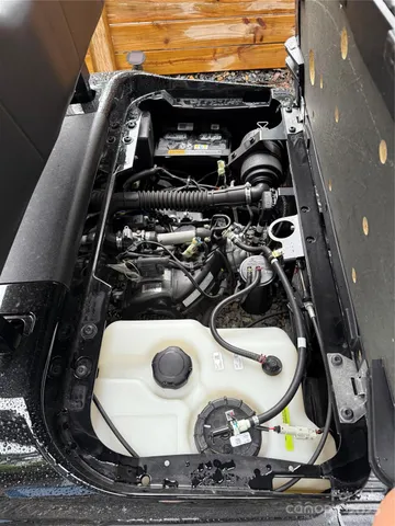 a view of a backyard with seating space