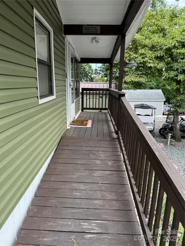 a balcony with wooden floor