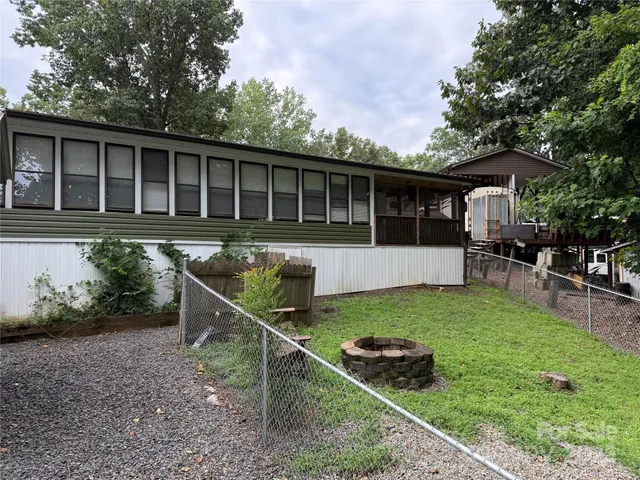 a house view with a sitting space and garden