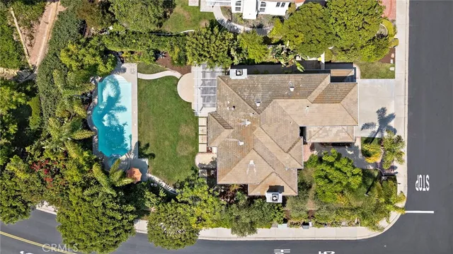 an aerial view of a residential houses and city street