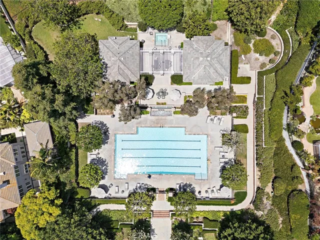 an aerial view of a residential houses with street