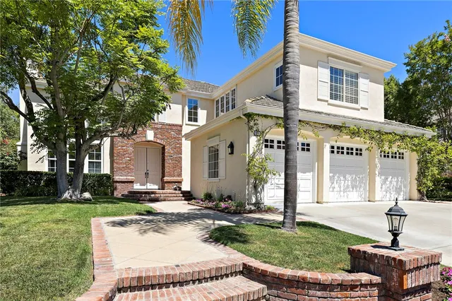 a front view of a building with garden