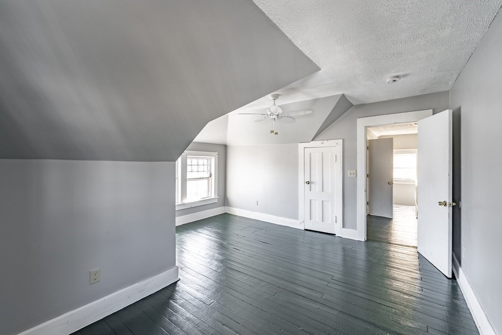 71 Mountainview Street Springfield, MA 01108 - Photo 15 of 21 wooden floor in an empty room with a window