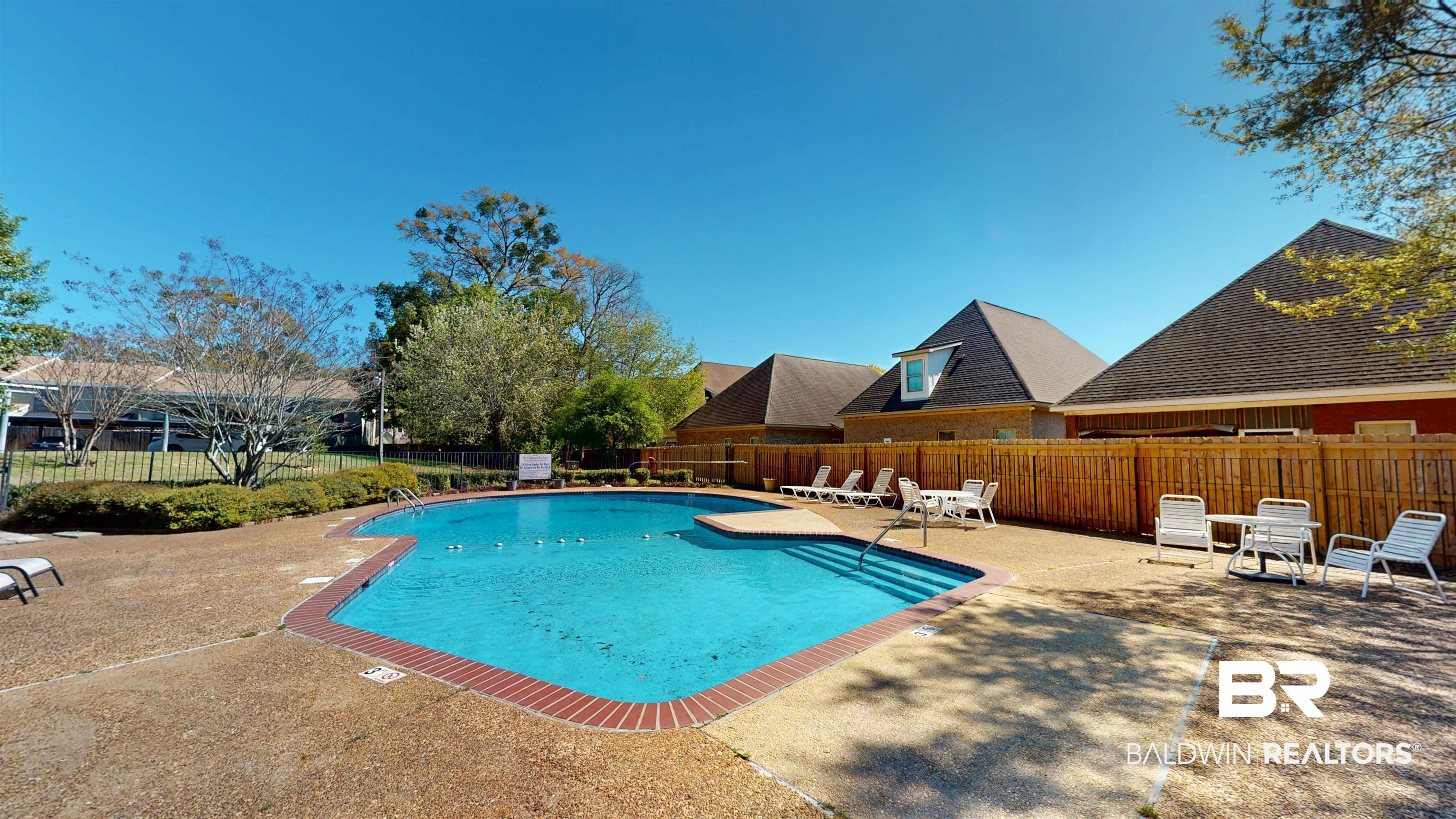 2901 Grant Street, Unit 902 Mobile, AL 36606 - Photo 27 of 35 Community pool featuring a patio area