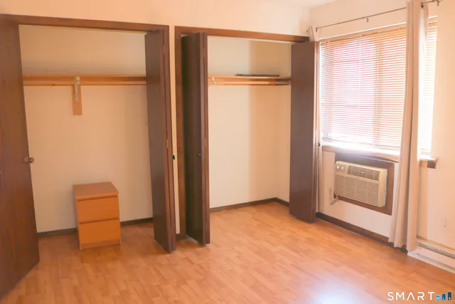 a view of an empty room with a closet