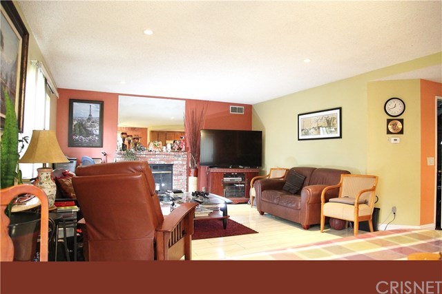 11545 Honeyglen Road Pacoima, CA 91331 - Photo 3 of 14 Bright and airy, spacious living room with a fireplace