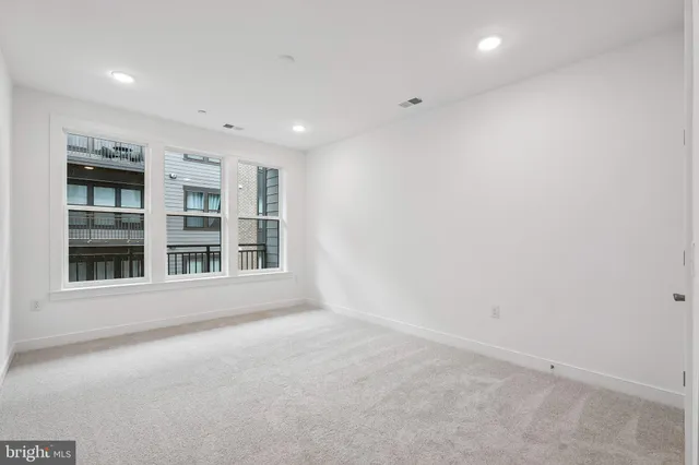 a bathroom with a toilet sink and shower