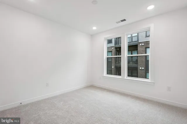 a view of a balcony with wooden floor