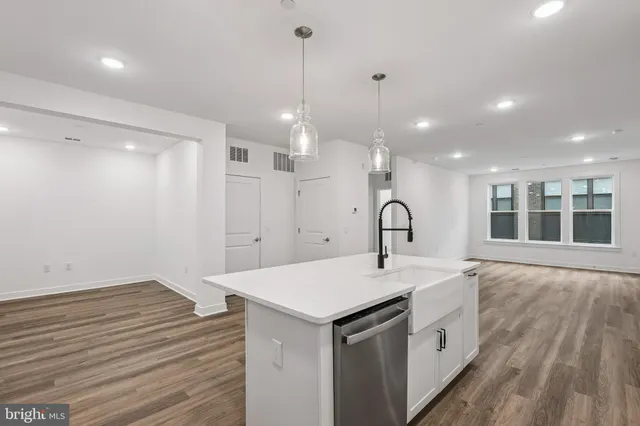 a view of a kitchen with wooden floor