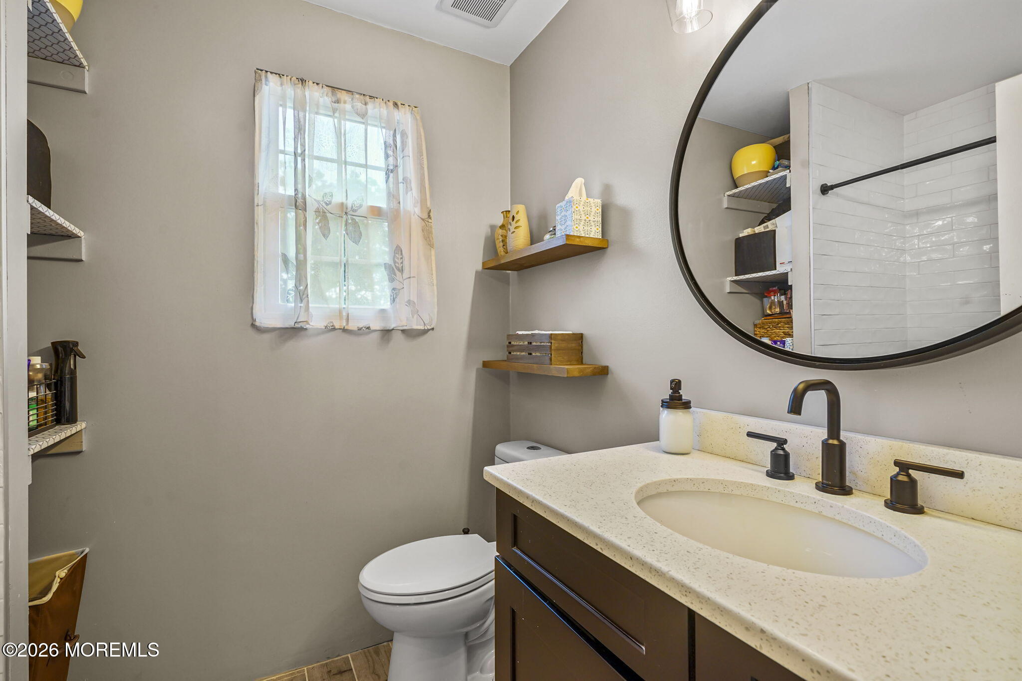 438 Bennetts Mills Road Jackson, NJ 08527 - Photo 18 of 42 a bathroom with a toilet sink and mirror