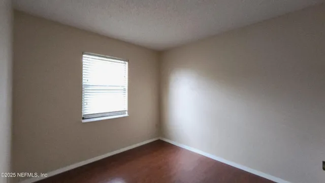 a view of a big room with closet and bathroom