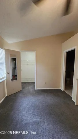 a house with trees in the background