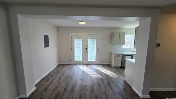 a view of livingroom with hardwood floor and a ceiling fan