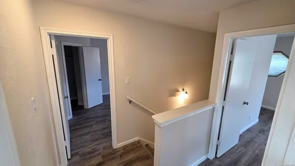 a view of a hallway view with staircase