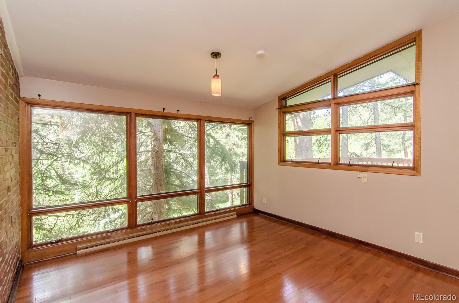 31463 Upper Bear Creek Road Evergreen, CO 80439 - Photo 13 of 23 a view of an empty room with a window