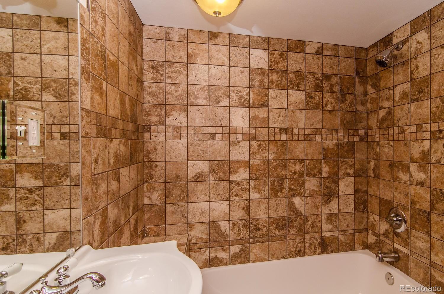 31463 Upper Bear Creek Road Evergreen, CO 80439 - Photo 14 of 23 a bathroom with a toilet and shower