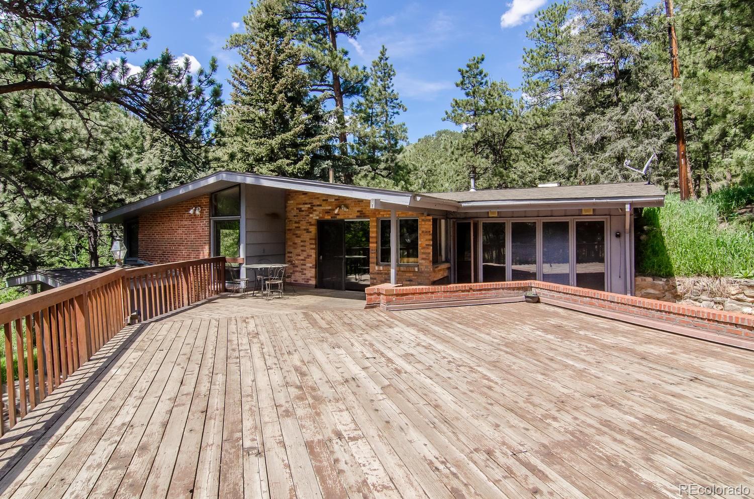 31463 Upper Bear Creek Road Evergreen, CO 80439 - Photo 23 of 23 a view of house with a entertaining space