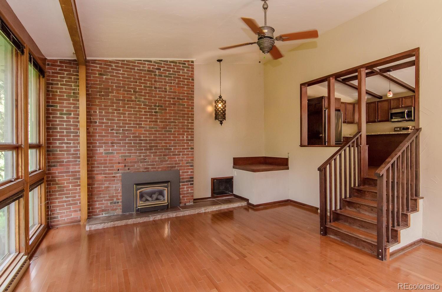 31463 Upper Bear Creek Road Evergreen, CO 80439 - Photo 6 of 23 a view of livingroom with furniture and a fireplace