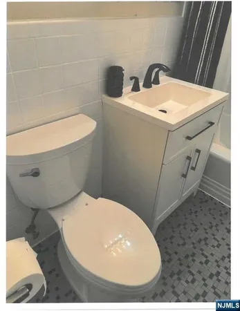 a bathroom with a toilet and a sink