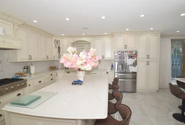 a kitchen with stainless steel appliances kitchen island granite countertop a sink and cabinets