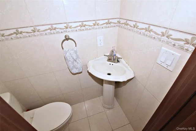 a bathroom with a sink a mirror and a shower