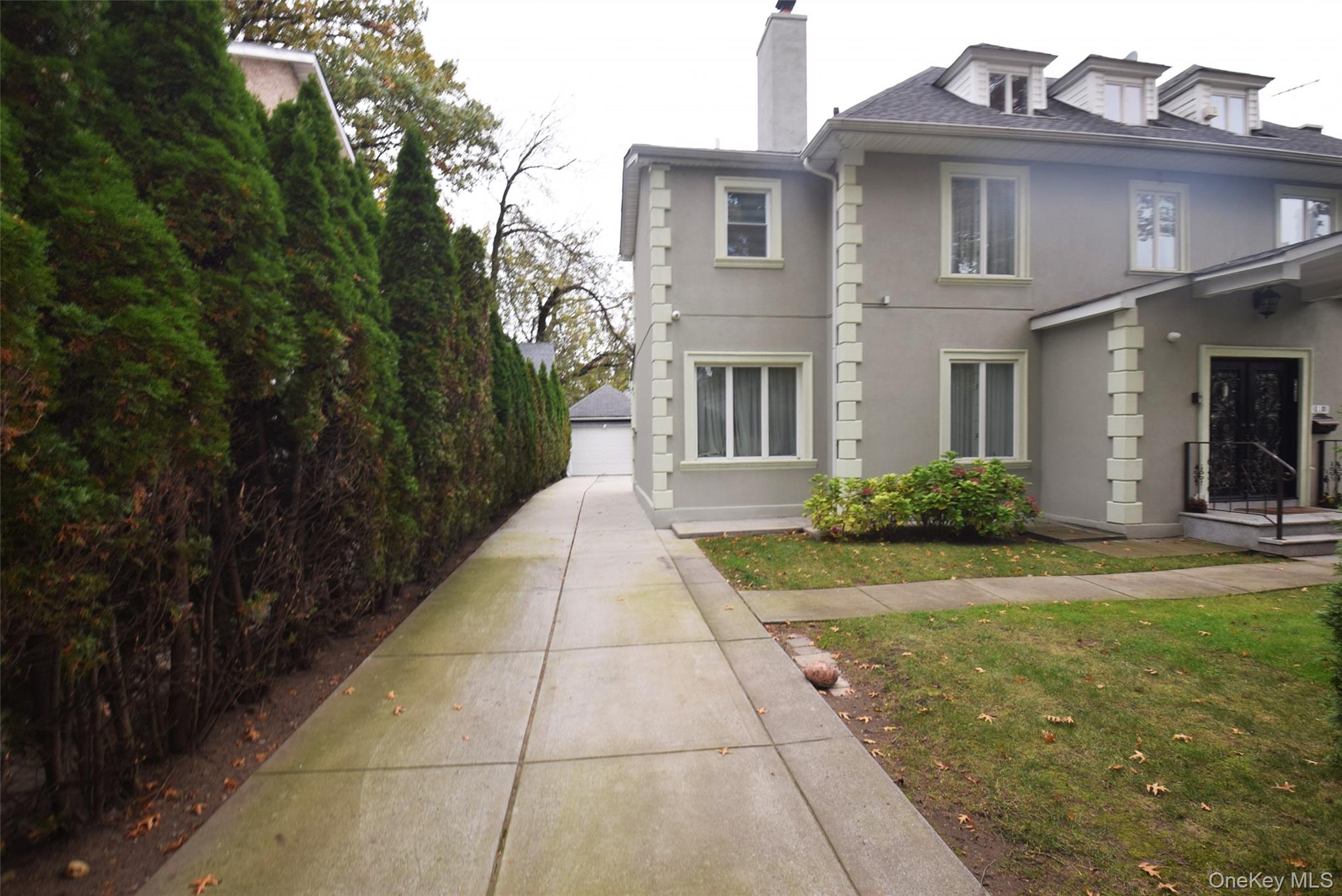 1-10 82nd Avenue Queens, NY 11415 - Photo 2 of 50 a view of a brick house with many windows
