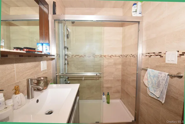 a bathroom with a sink and a shower