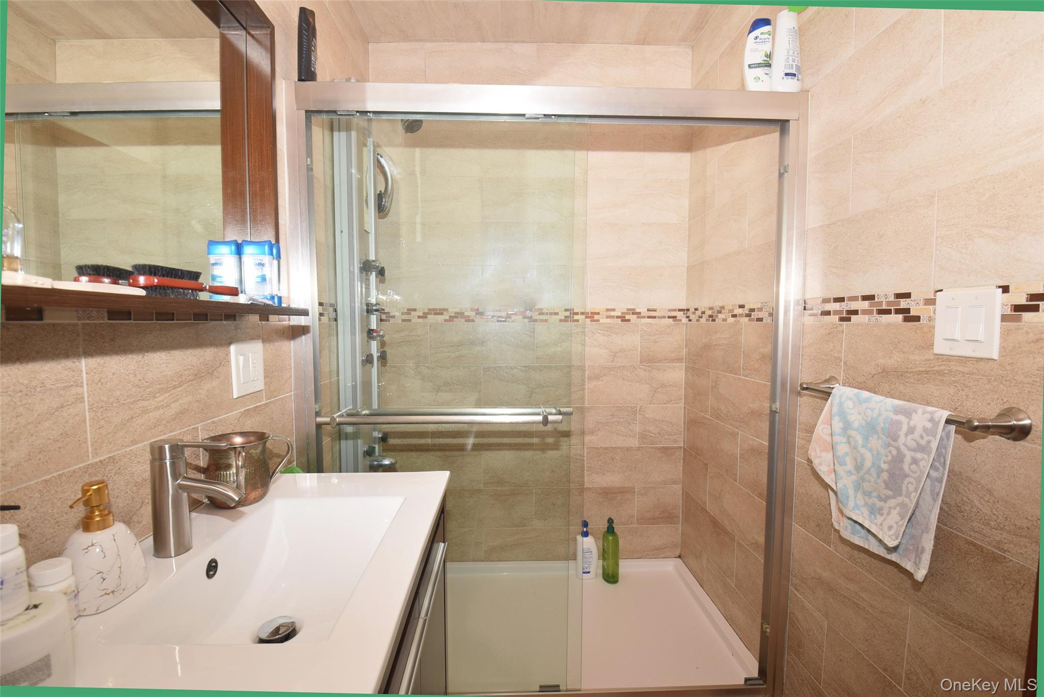 1-10 82nd Avenue Queens, NY 11415 - Photo 21 of 50 a bathroom with a sink and a shower