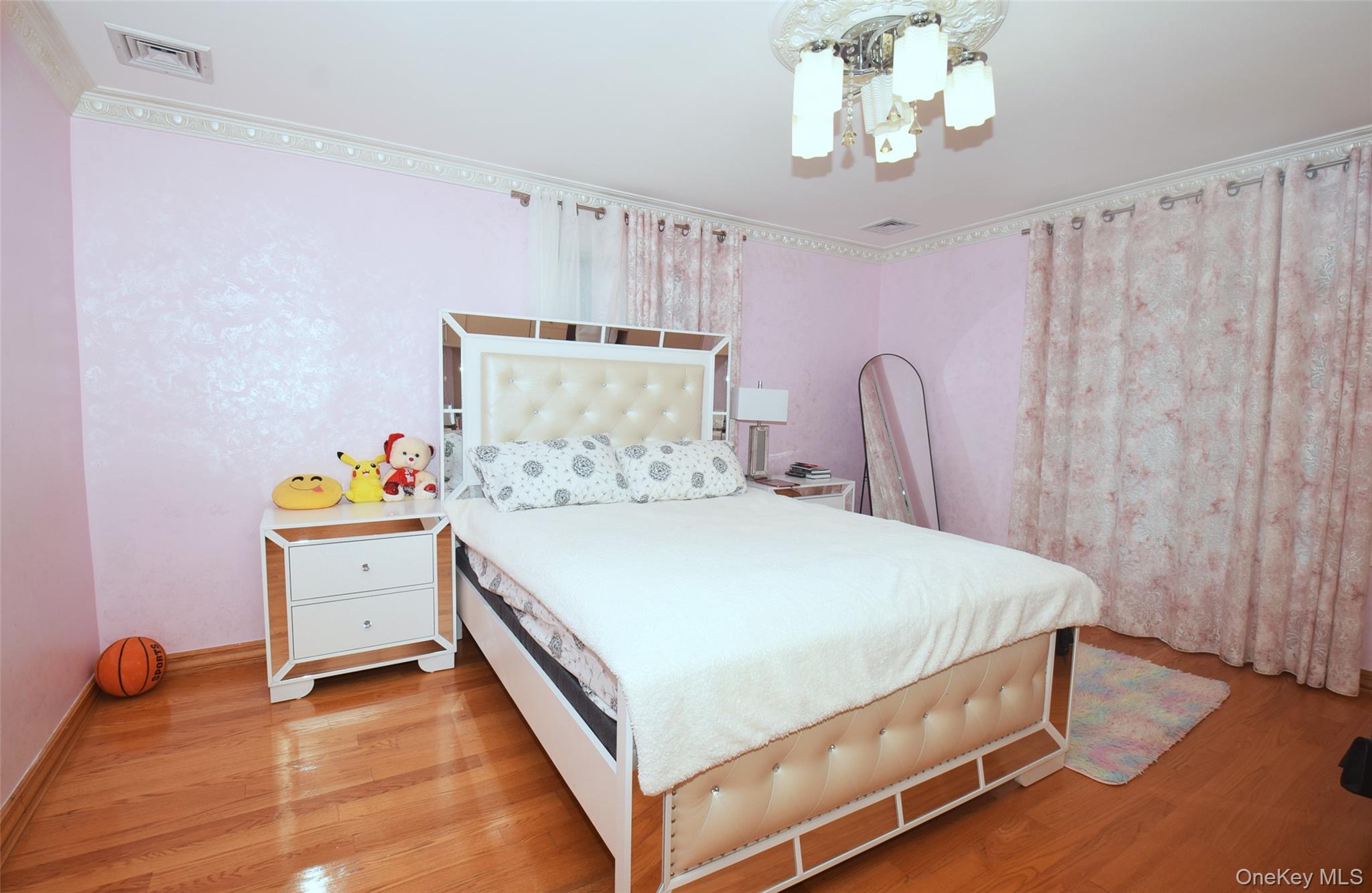 1-10 82nd Avenue Queens, NY 11415 - Photo 25 of 50 a bedroom with a bed and a dresser