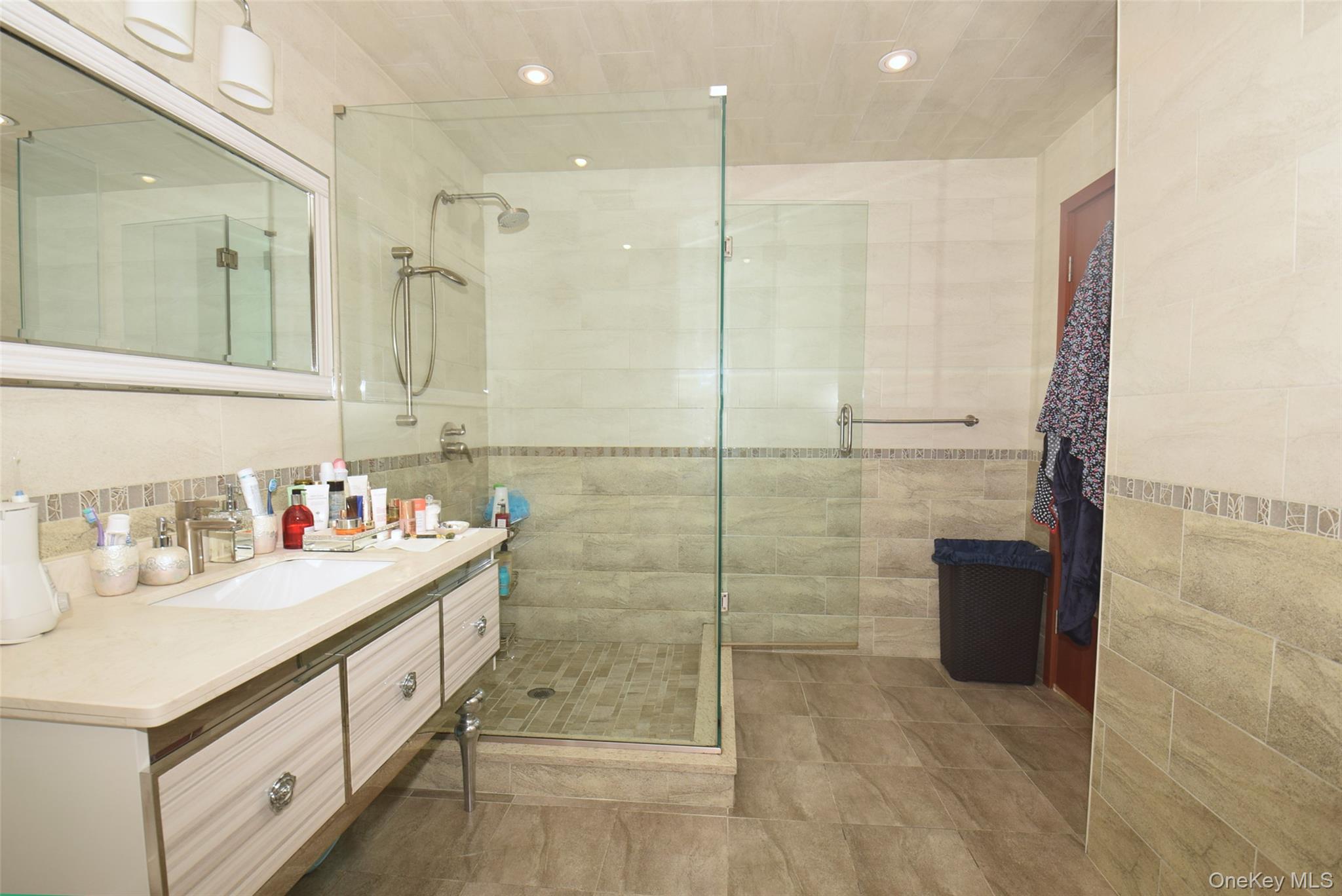 1-10 82nd Avenue Queens, NY 11415 - Photo 35 of 50 a bathroom with a sink and a shower