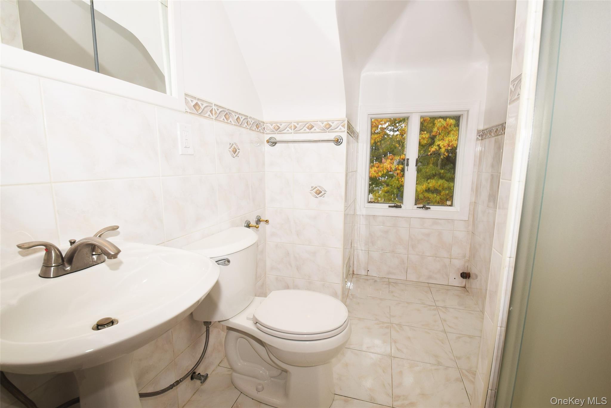 1-10 82nd Avenue Queens, NY 11415 - Photo 38 of 50 a bathroom with a sink a toilet and shower