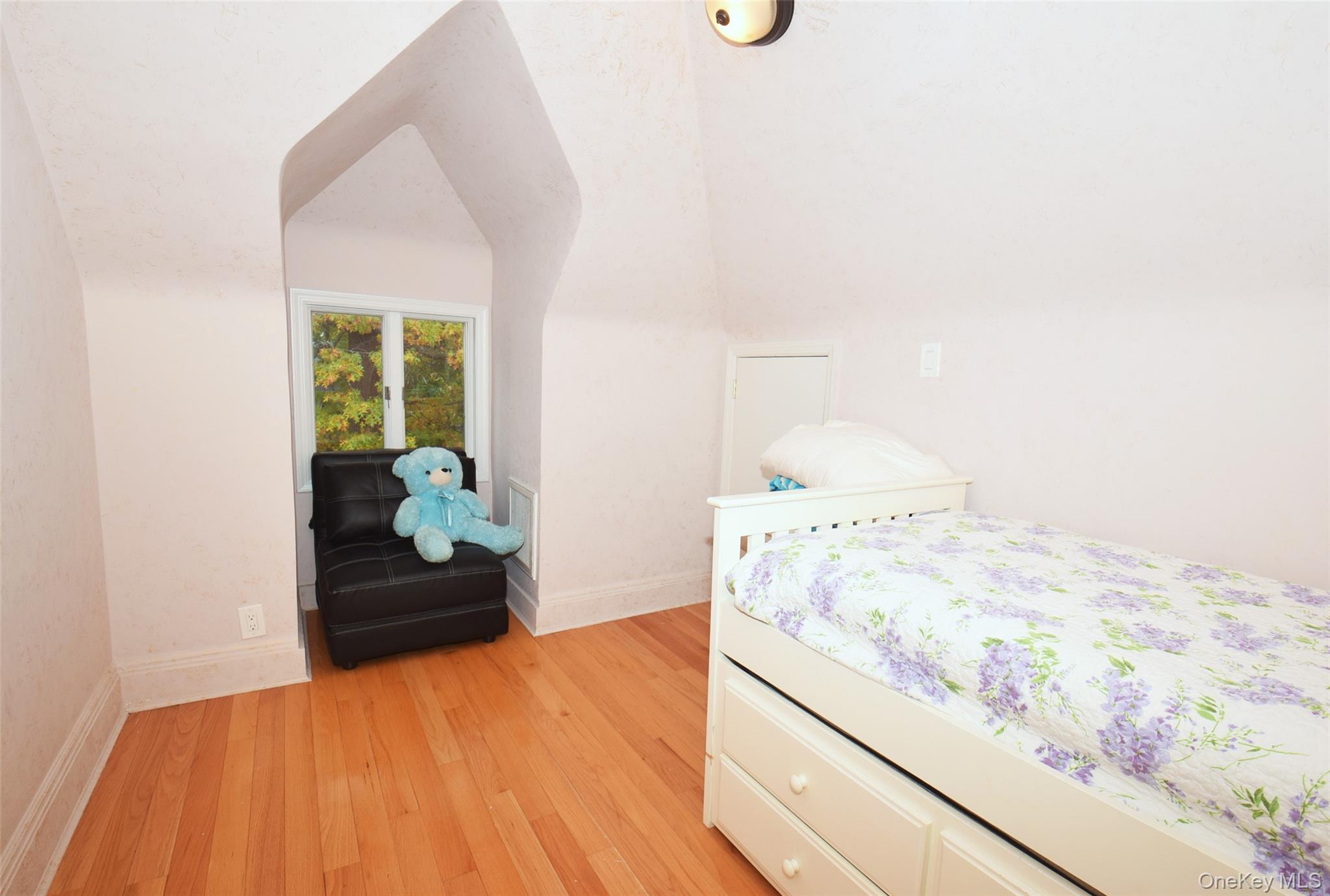 1-10 82nd Avenue Queens, NY 11415 - Photo 39 of 50 a bedroom with a bed and a dresser