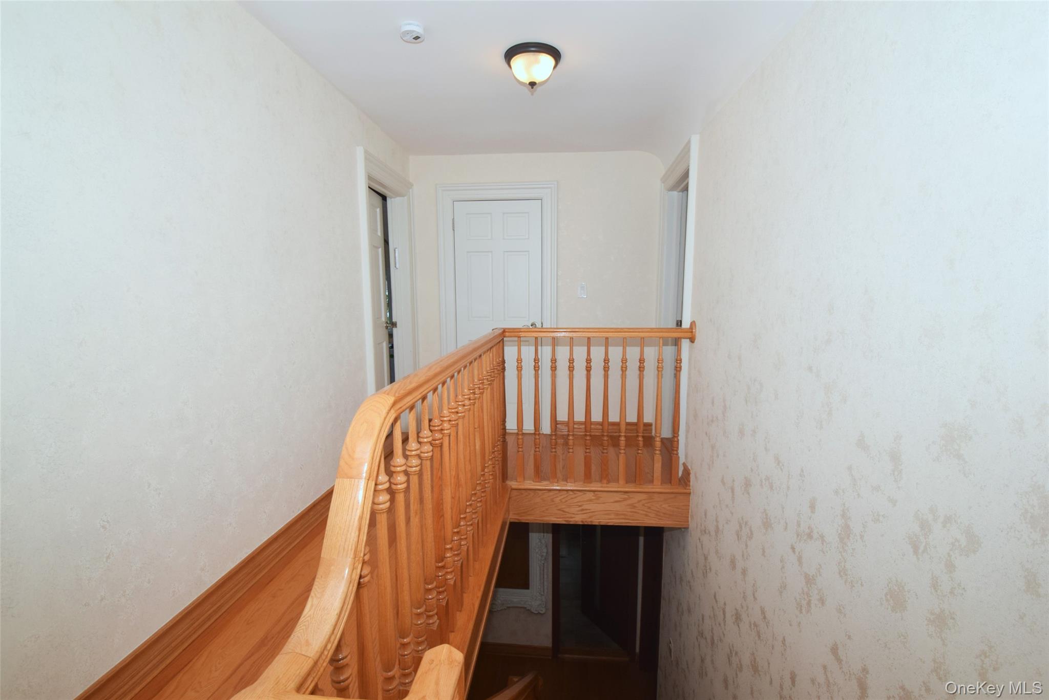 1-10 82nd Avenue Queens, NY 11415 - Photo 40 of 50 a view of staircase with wooden floor