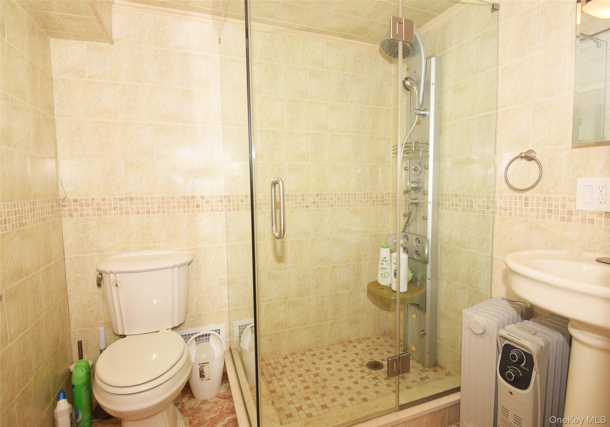 1-10 82nd Avenue Queens, NY 11415 - Photo 41 of 50 a bathroom with a toilet and a shower