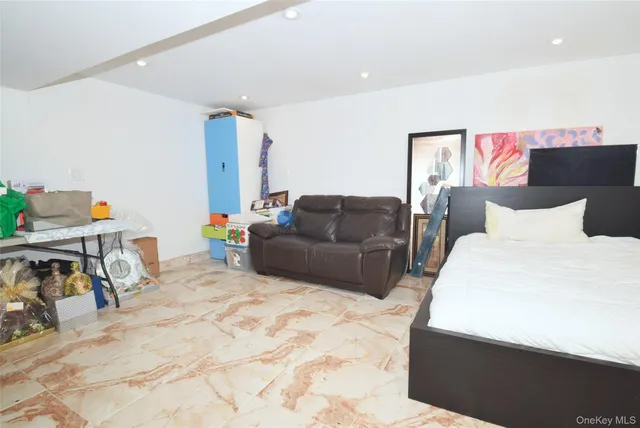 a view of living room with furniture and a window