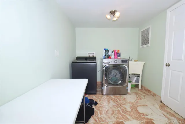 a view of patio with a table and chairs under an umbrella