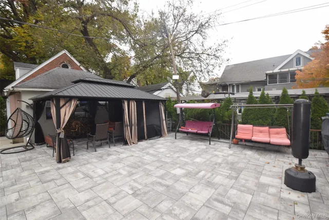 a view of house with outdoor seating space