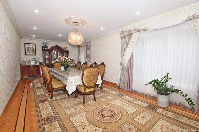 a dining room with furniture and wooden floor