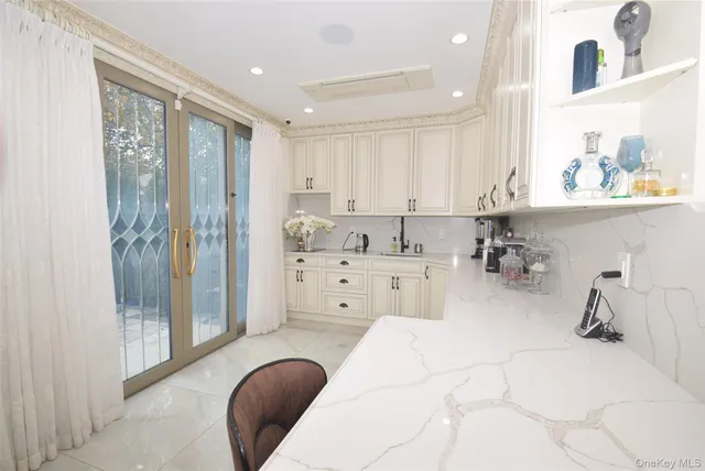 a bedroom with furniture and a glass door