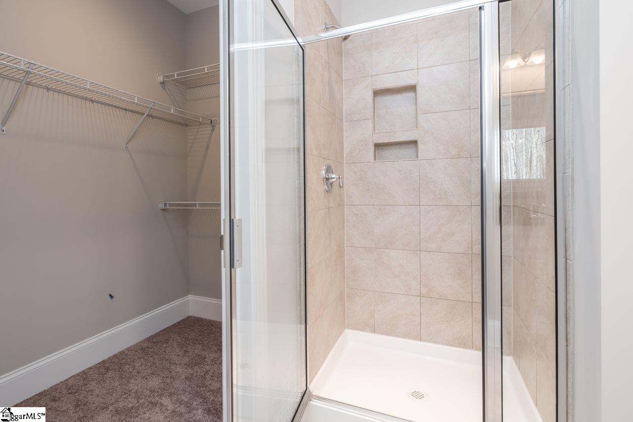 216 Donemere Way Fountain Inn, SC 29644 - Photo 22 of 32 Tiled Shower in Master Bath and one of the two walk-in closets in the master bath area.